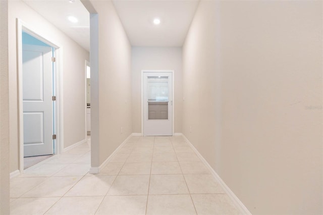 hallway featuring light tile patterned floors