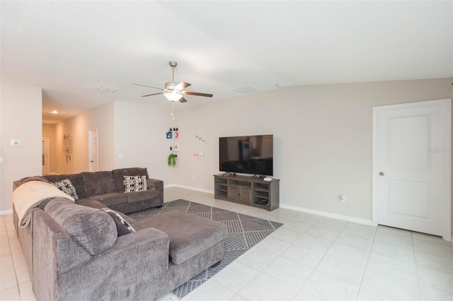 living room with vaulted ceiling, light tile patterned floors, and ceiling fan