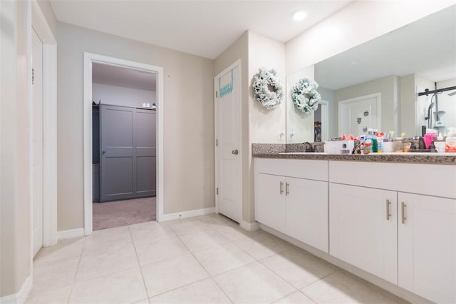 bathroom with vanity and tile patterned flooring