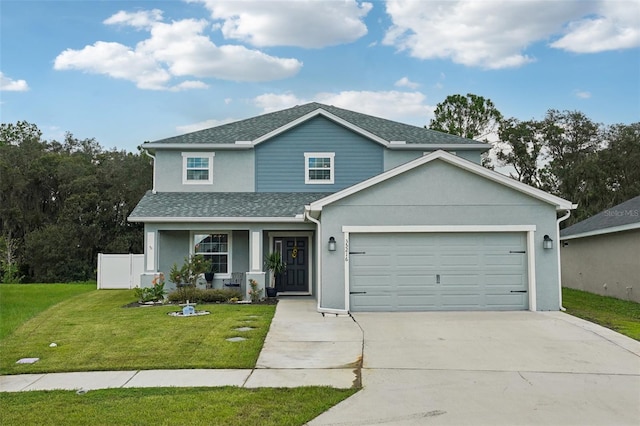 view of front of home featuring a garage, a porch, and a front lawn