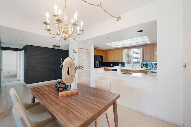 carpeted dining area featuring a notable chandelier