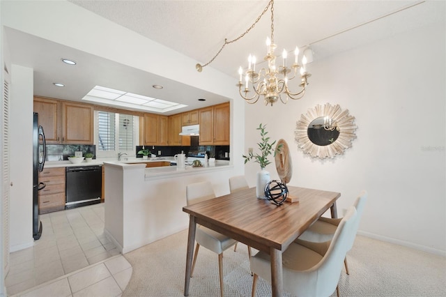 tiled dining area with an inviting chandelier