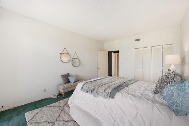 carpeted bedroom featuring a closet