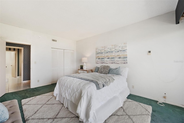 carpeted bedroom featuring a closet