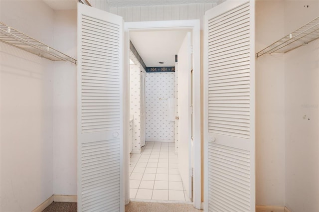 hallway featuring light tile patterned flooring