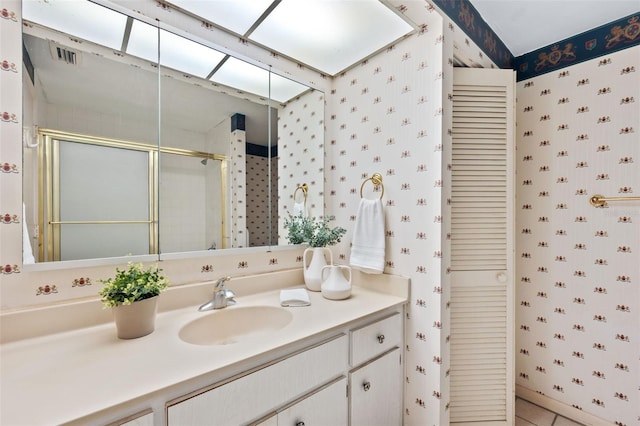 bathroom with vanity and an enclosed shower