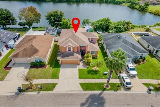 birds eye view of property featuring a water view