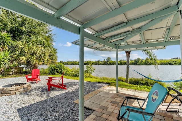 view of patio / terrace featuring a water view and an outdoor fire pit