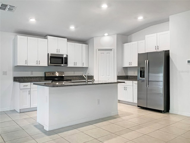 kitchen with a sink, stainless steel appliances, visible vents, and white cabinetry