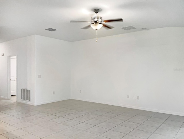 empty room with a ceiling fan, visible vents, and baseboards