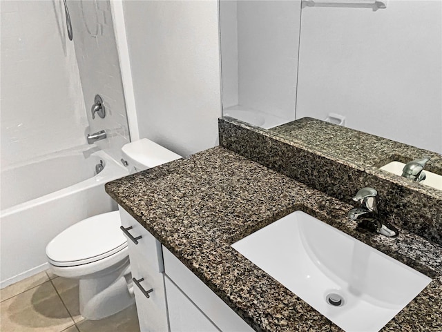 bathroom featuring shower / bathing tub combination, toilet, vanity, and tile patterned flooring