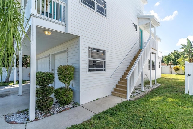 view of side of property with a yard