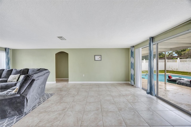 spare room with a textured ceiling