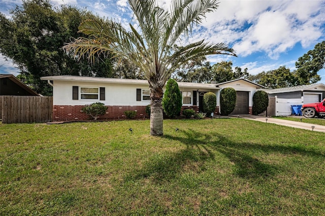 single story home with a garage and a front lawn