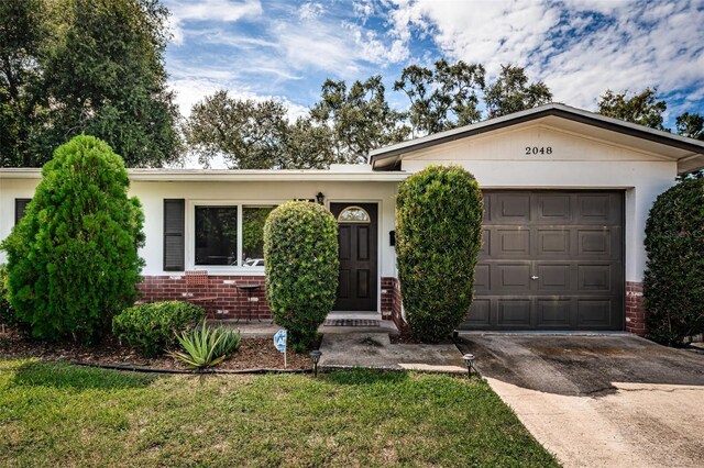 single story home with a garage