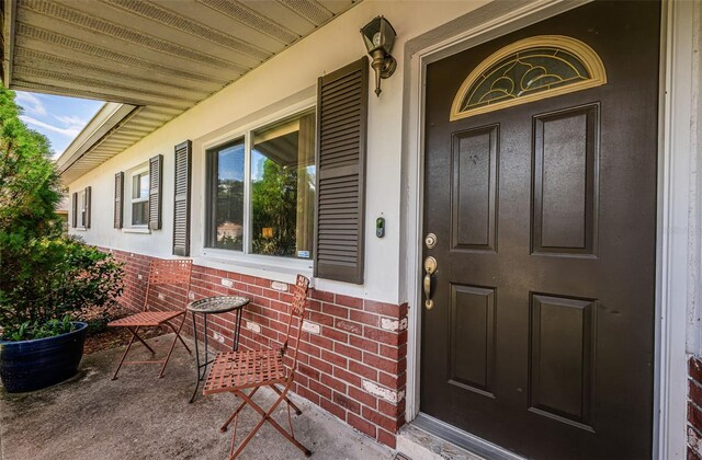 entrance to property with covered porch