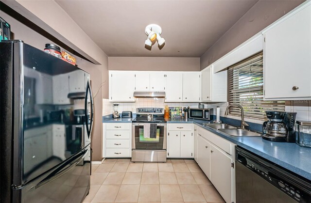 kitchen featuring appliances with stainless steel finishes, sink, white cabinets, and decorative backsplash