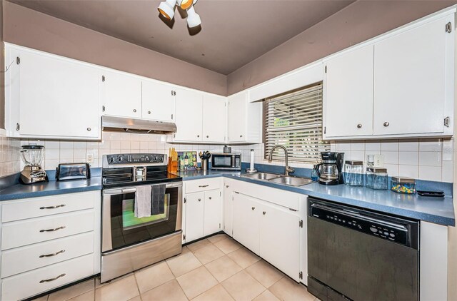 kitchen featuring white cabinets, stainless steel appliances, tasteful backsplash, and sink