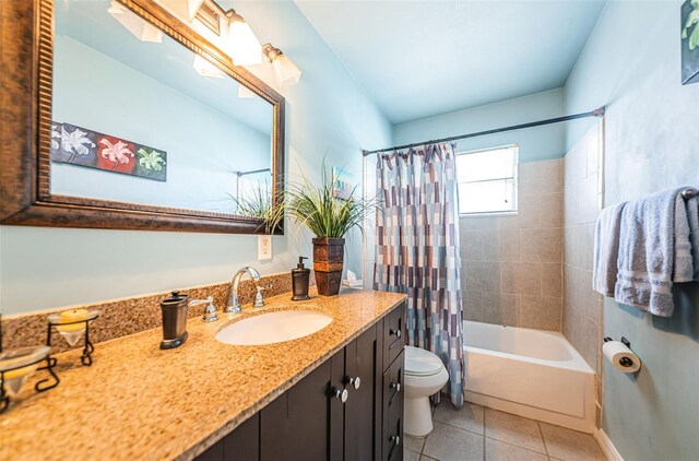 full bathroom with tile patterned flooring, shower / bath combination with curtain, toilet, and vanity