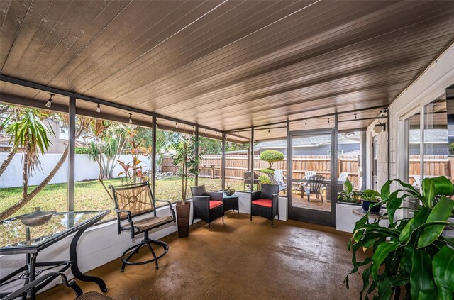 unfurnished sunroom with a wealth of natural light