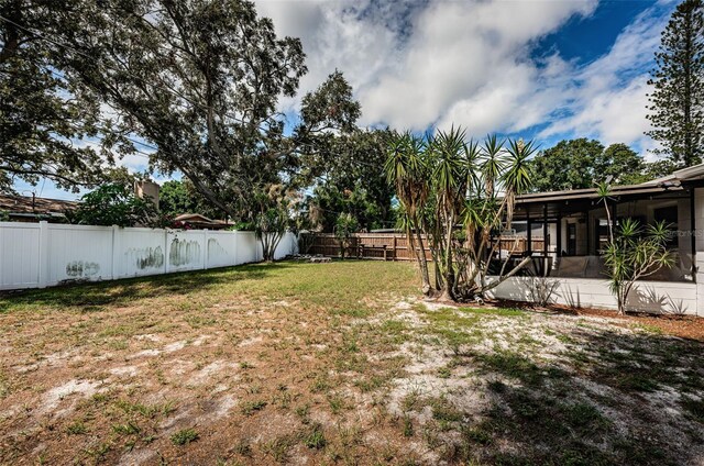 view of yard with a sunroom