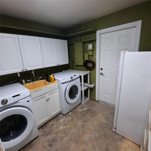 laundry area featuring sink, light colored carpet, cabinets, electric panel, and washing machine and dryer