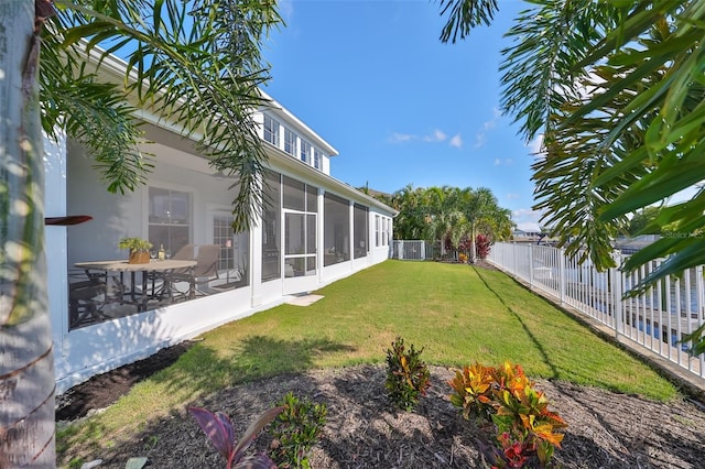 view of yard with a sunroom