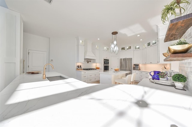 bedroom featuring a sink, freestanding refrigerator, and recessed lighting