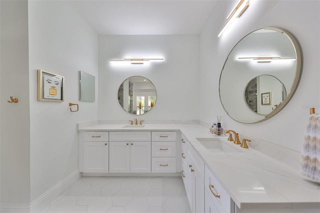 full bathroom with baseboards and vanity