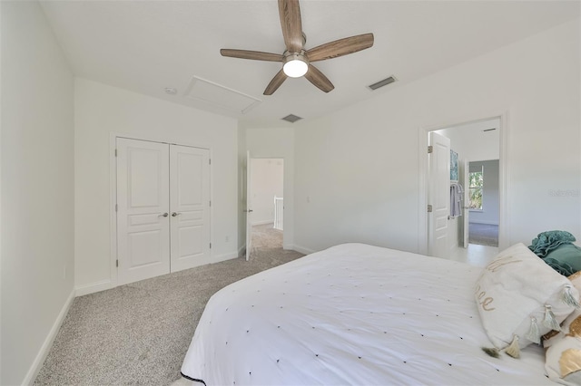 bedroom featuring light carpet, attic access, visible vents, baseboards, and a closet