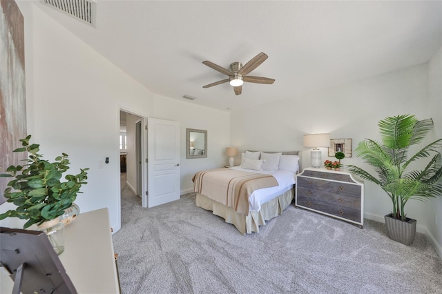 bedroom featuring ceiling fan, carpet flooring, visible vents, and baseboards