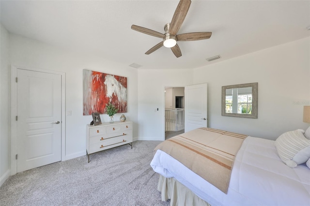 bedroom featuring carpet floors, a ceiling fan, visible vents, and baseboards