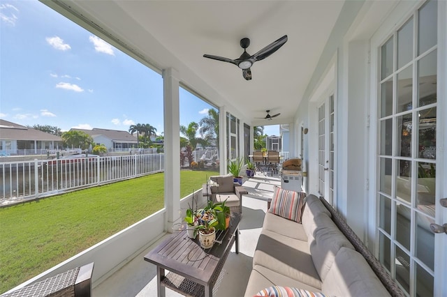 sunroom with a ceiling fan