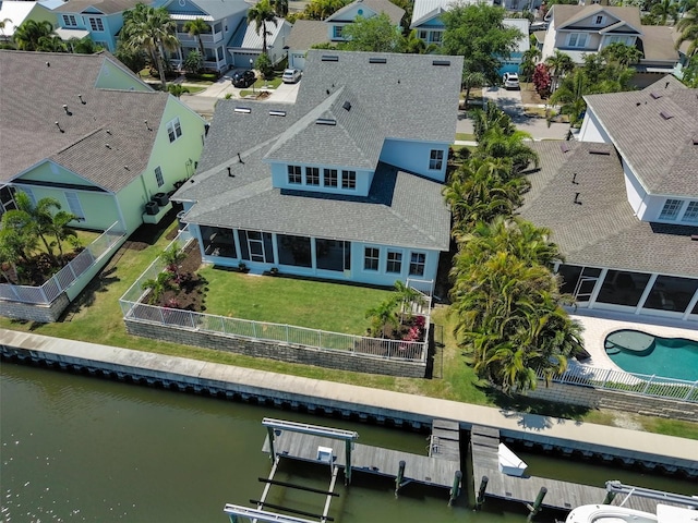 bird's eye view featuring a residential view and a water view