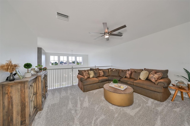 carpeted living room featuring visible vents and ceiling fan