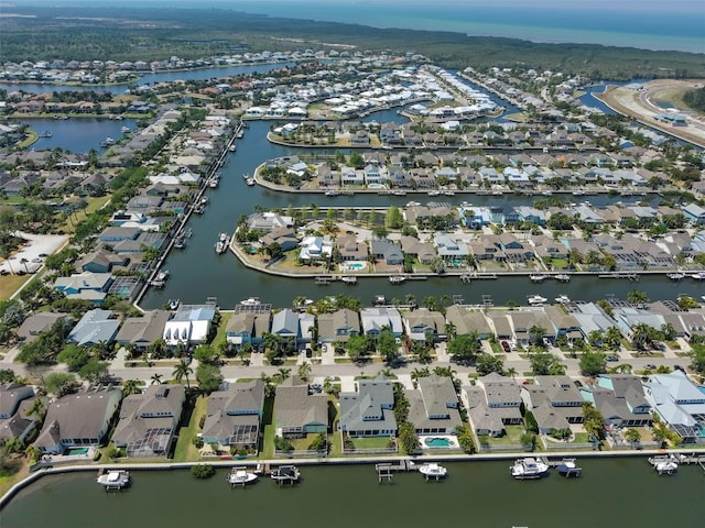 bird's eye view featuring a water view and a residential view