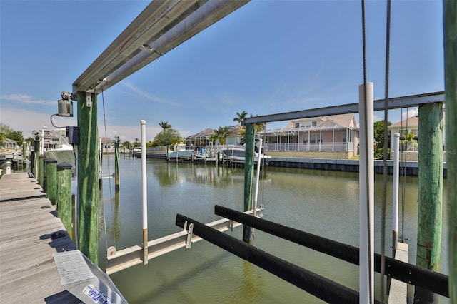 view of dock with a water view and boat lift