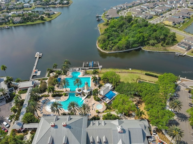 birds eye view of property featuring a residential view and a water view