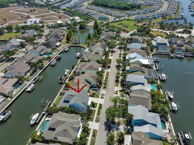 birds eye view of property featuring a residential view and a water view