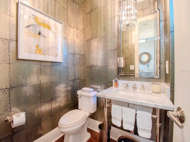 bathroom featuring sink and toilet