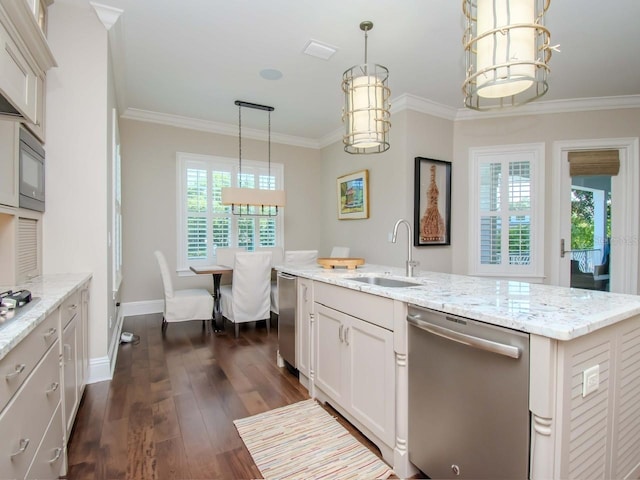 kitchen featuring decorative light fixtures, dishwasher, sink, crown molding, and an island with sink