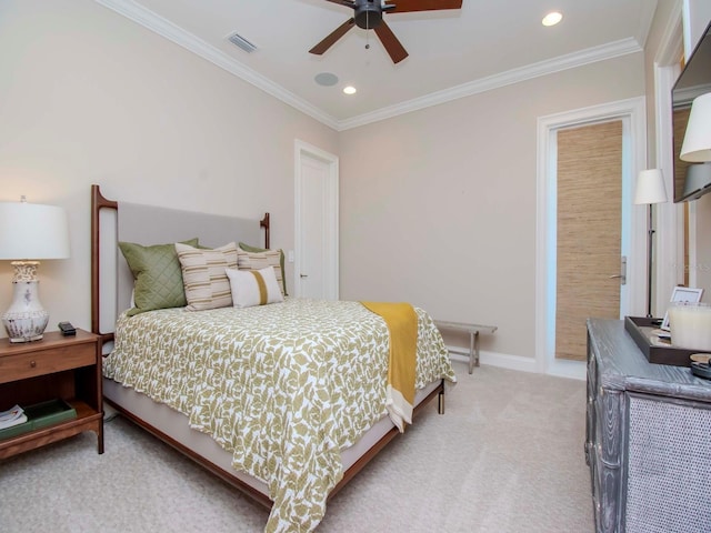 carpeted bedroom featuring ceiling fan and ornamental molding