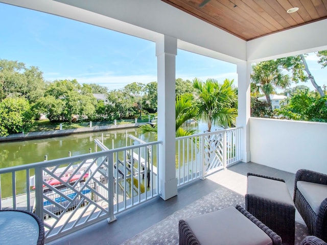 balcony featuring a water view