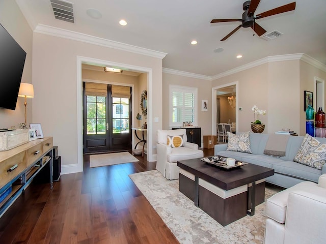 living room featuring ceiling fan, crown molding, and dark hardwood / wood-style floors