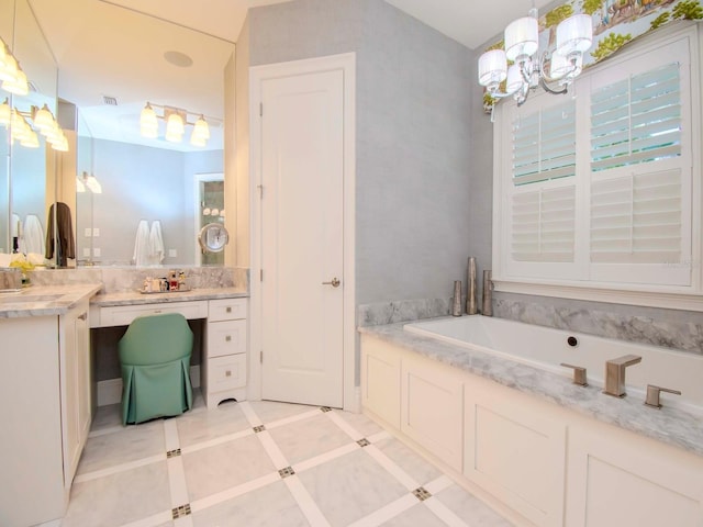 bathroom with a tub to relax in, vanity, and tile patterned flooring