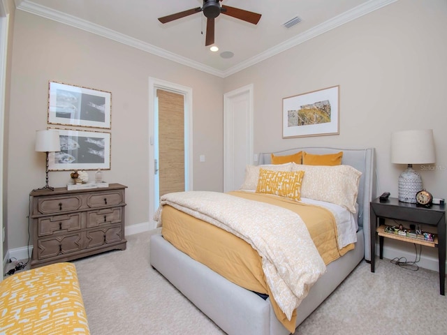 carpeted bedroom with ceiling fan and crown molding