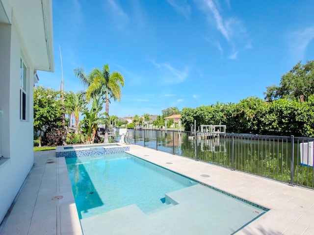 view of pool with a water view