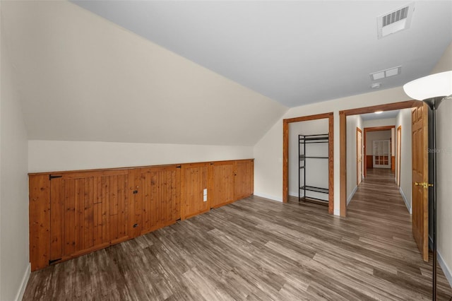 bonus room featuring hardwood / wood-style flooring, a baseboard radiator, and vaulted ceiling