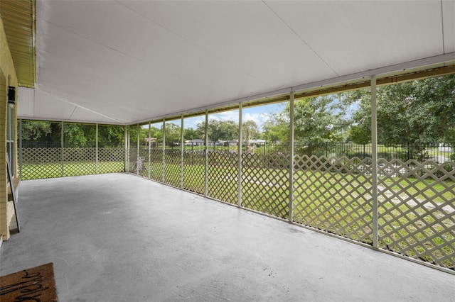 unfurnished sunroom with vaulted ceiling