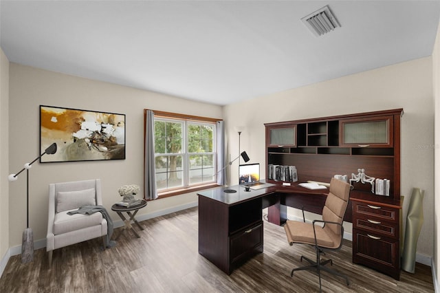 home office with dark wood-type flooring